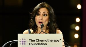 Emcee Valerie Smaldone at podium